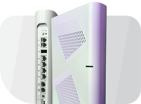 A white wireless router is shown standing upright, displaying its side vents and rear ports, including Ethernet, power connections, and a dedicated port for business fiber or phone line integration.